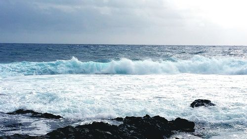 Waves splashing on rocks