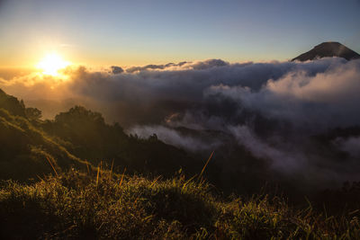 Scenic view of landscape against sky during sunset