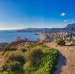 Scenic view of sea against blue sky