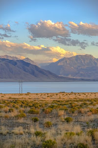 Scenic view of landscape and mountains against sky