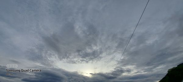 Low angle view of road sign against sky