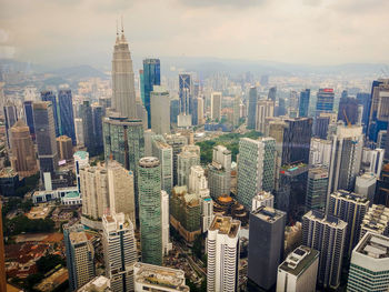 Aerial view of cityscape against sky