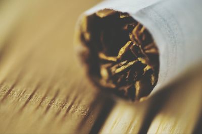 Close-up of cigarette on table