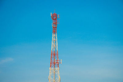 Low angle view of communications tower against sky