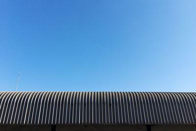 Low angle view of building against clear blue sky