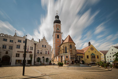 Street amidst buildings in city against sky