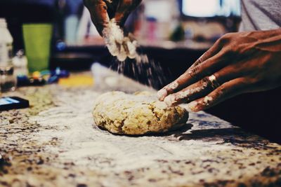 Close-up of man preparing food