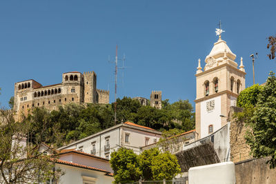 Low angle view of bell tower against sky