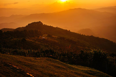 Scenic view of mountains against sky during sunset