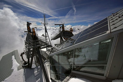 Overhead cable car station on snowcapped mountain