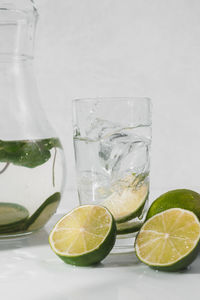 Glass of fruit and drink on table