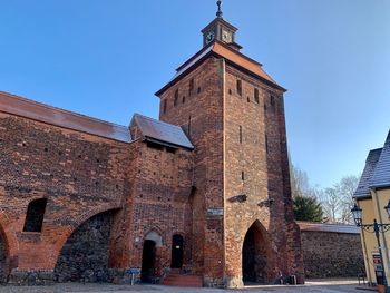 Low angle view of old building against sky