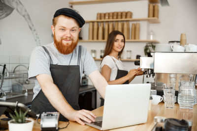 Portrait of friends working in office