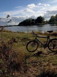 Bicycle on field against sky