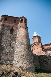 Low angle view of old building against sky