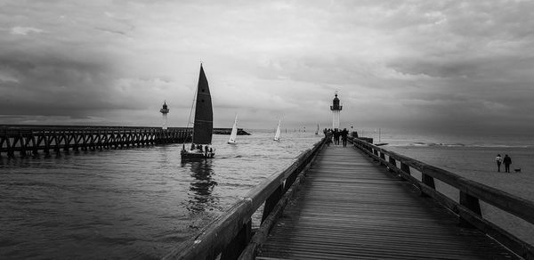 Pier over sea against sky