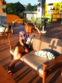 Woman sitting on chair at table