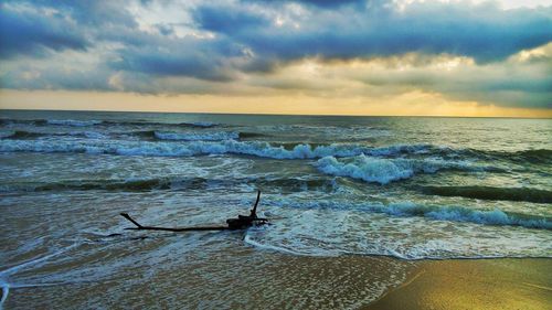 Scenic view of sea against dramatic sky