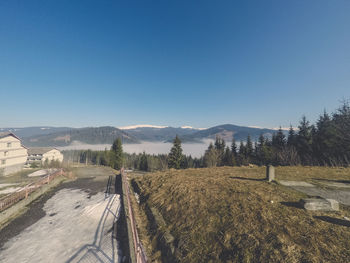 Panoramic view of landscape against clear blue sky