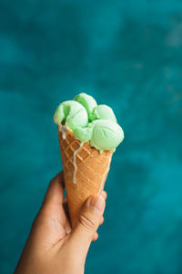 Cropped image of hand holding ice cream