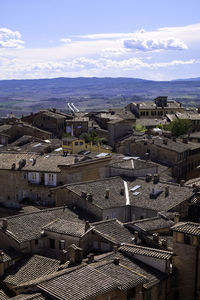 Aerial view of siena from facciatone - red tiled traditional rooftops - siena, tuscany, italy