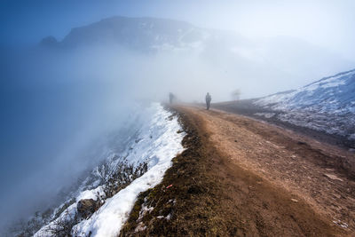 Mountain footpath during foggy weather