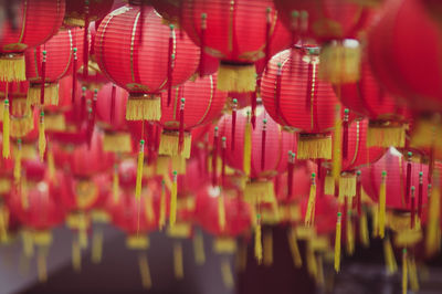 Close-up of red lanterns hanging outdoors
