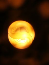 Close-up of illuminated light bulb