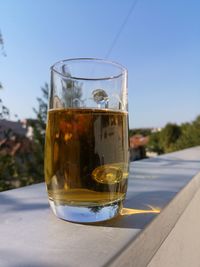 Close-up of beer glass on table