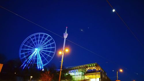 Low angle view of illuminated lamp post