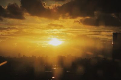 Scenic view of cityscape against sky during sunset