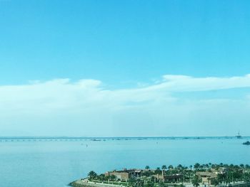 Scenic view of sea against blue sky