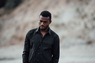 Portrait of young man looking away