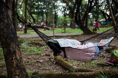 Close-up of a person sleeping on a hammock