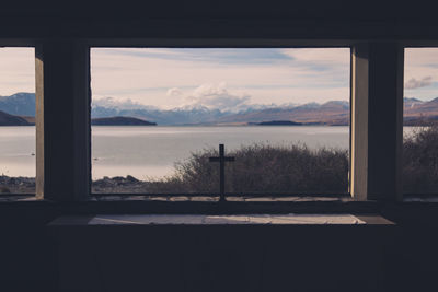 Scenic view of mountains against cloudy sky