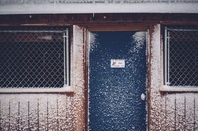 Close-up of building with blue door