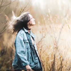 Side view of woman standing on field