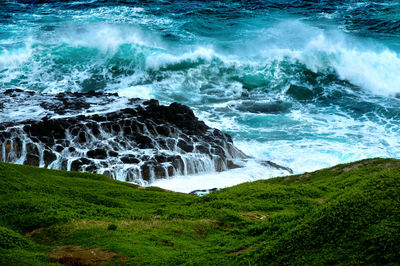 Waves splashing on rocks