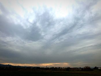 Scenic view of field against sky during sunset
