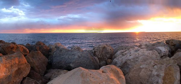 Scenic view of sea against sky during sunset