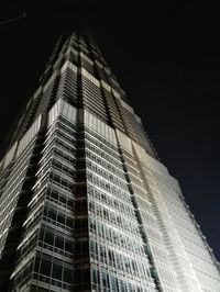 Low angle view of modern building at night