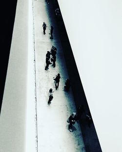 High angle view of silhouette people by swimming pool