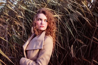 Portrait of beautiful woman on field