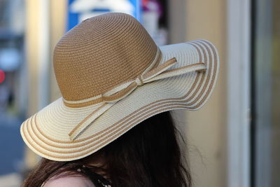 Close-up of woman wearing hat