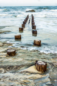 Illustration of old pilings at folly beach in florida state.