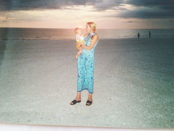 Full length of woman standing on beach