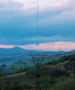 Scenic view of landscape against cloudy sky