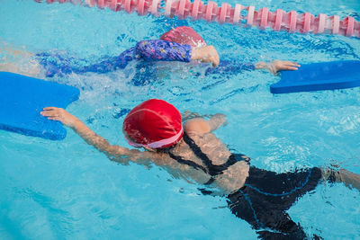 High angle view of woman swimming in pool