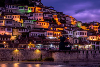 Illuminated buildings in water