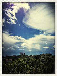 Scenic view of landscape against cloudy sky